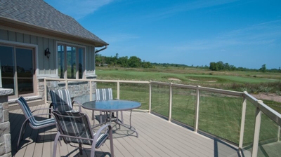 a scenic balcony with glass railings