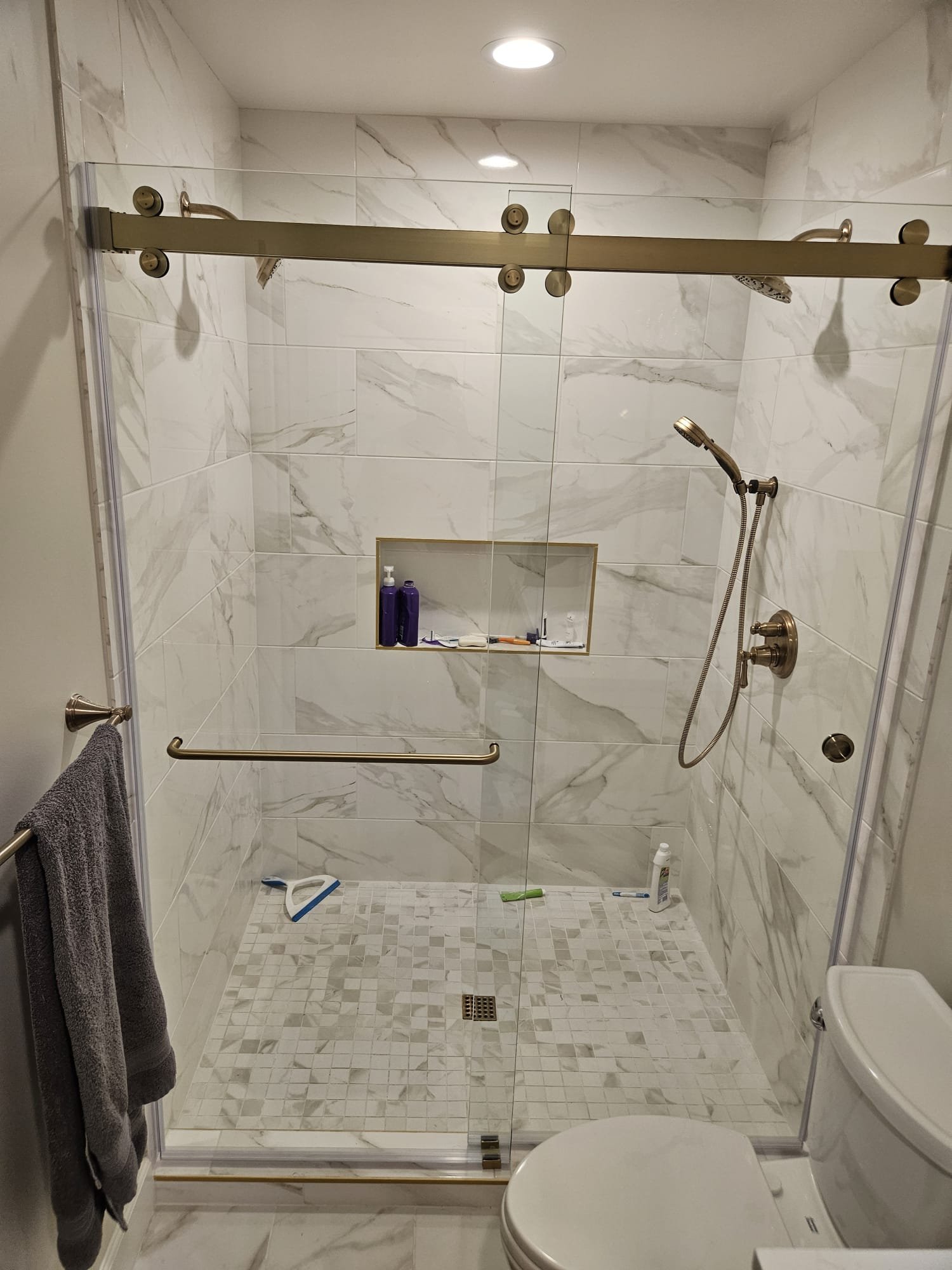 Frameless Slider Gold Towel Bar and Finger Pull