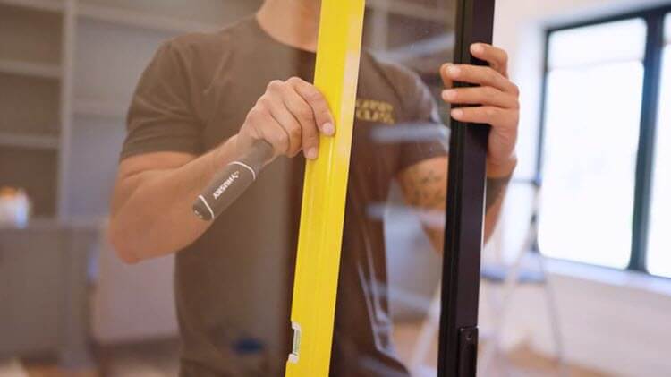 A Gatsby Glass professional repairing a window
